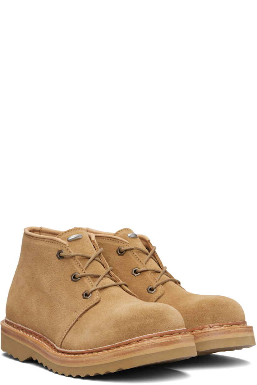 Ankle-high vegetable-tanned suede boots.

· Lace-up closure
· Logo hardware at tongue
· Buffed leather lining
· Topstitching at welt
· Foam rubber midsole
· Treaded Vibram® rubber sole

Supplier color: Medallion velour suede