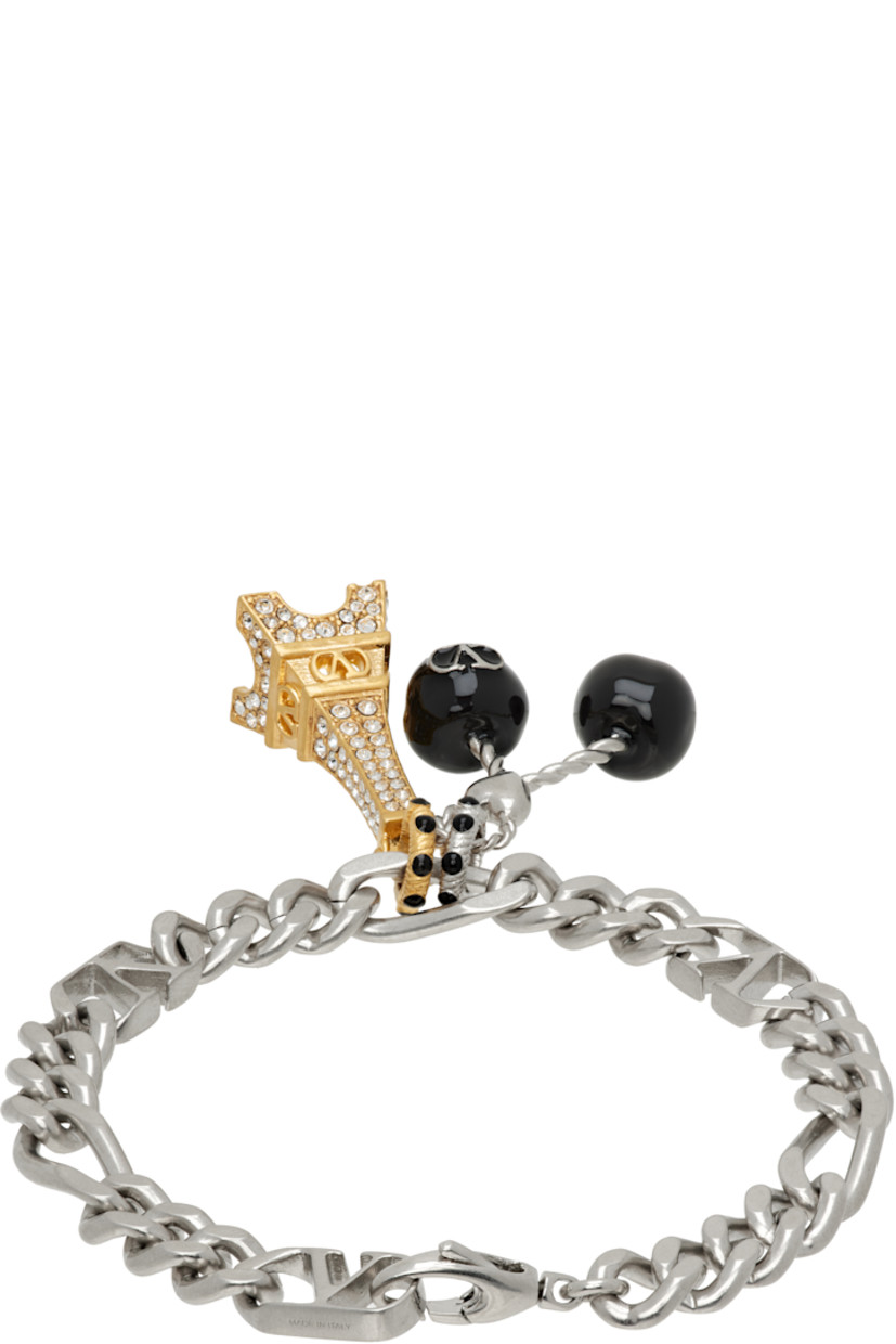 Curb chain bracelet in silver tone. 

· Logo plaques at length
· Graphic charms with black enamel and Swarovski crystals
· Lobster-clasp fastening

Supplier color: Palladium