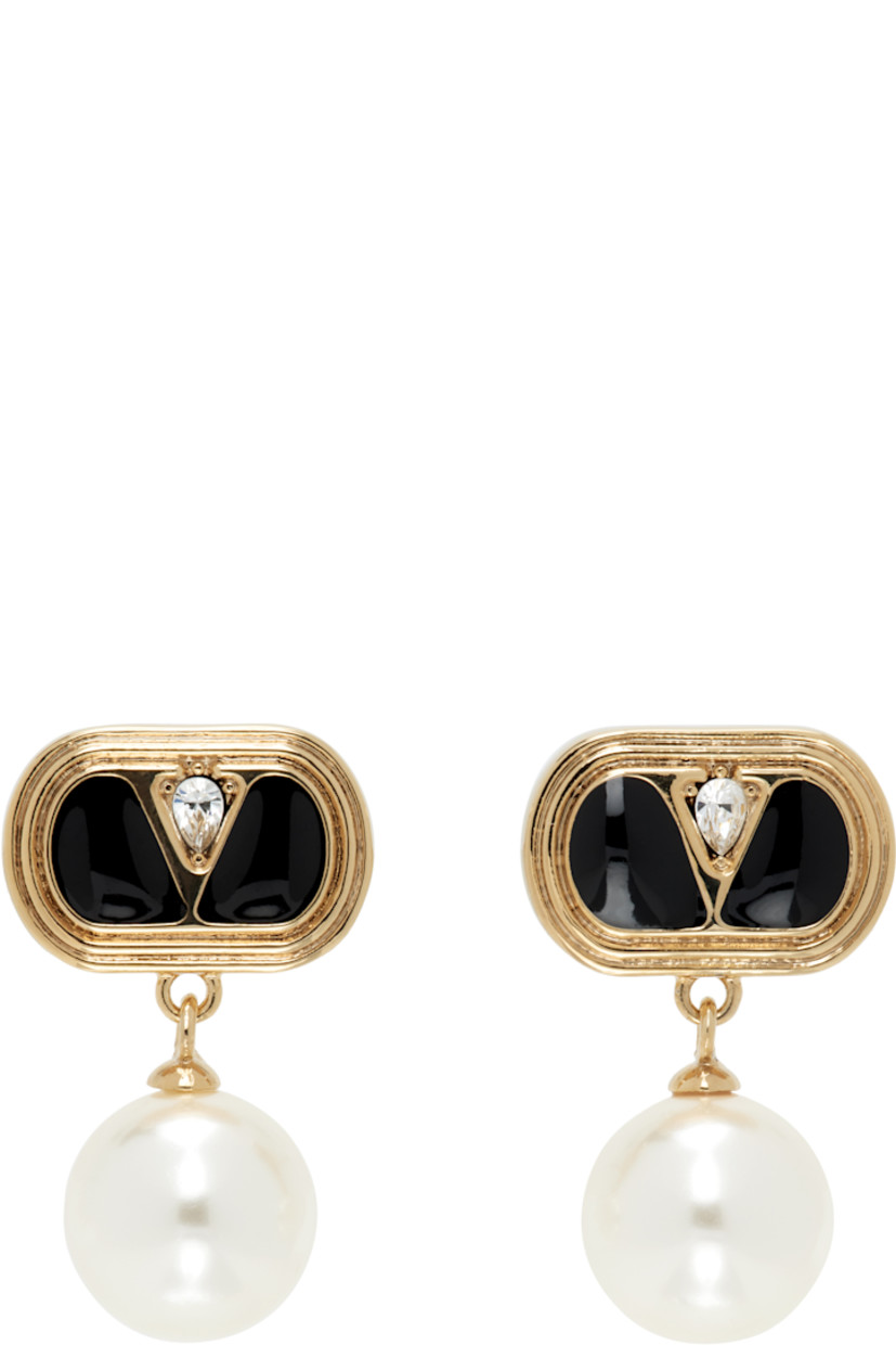 Pair of drop earrings in gold tone.

· Logo hardware, black enamel, and crystal at face
· Swarovski pearl at drop
· Post-stud fastening 
· H1" x W0.5"

Supplier color: Gold/Black