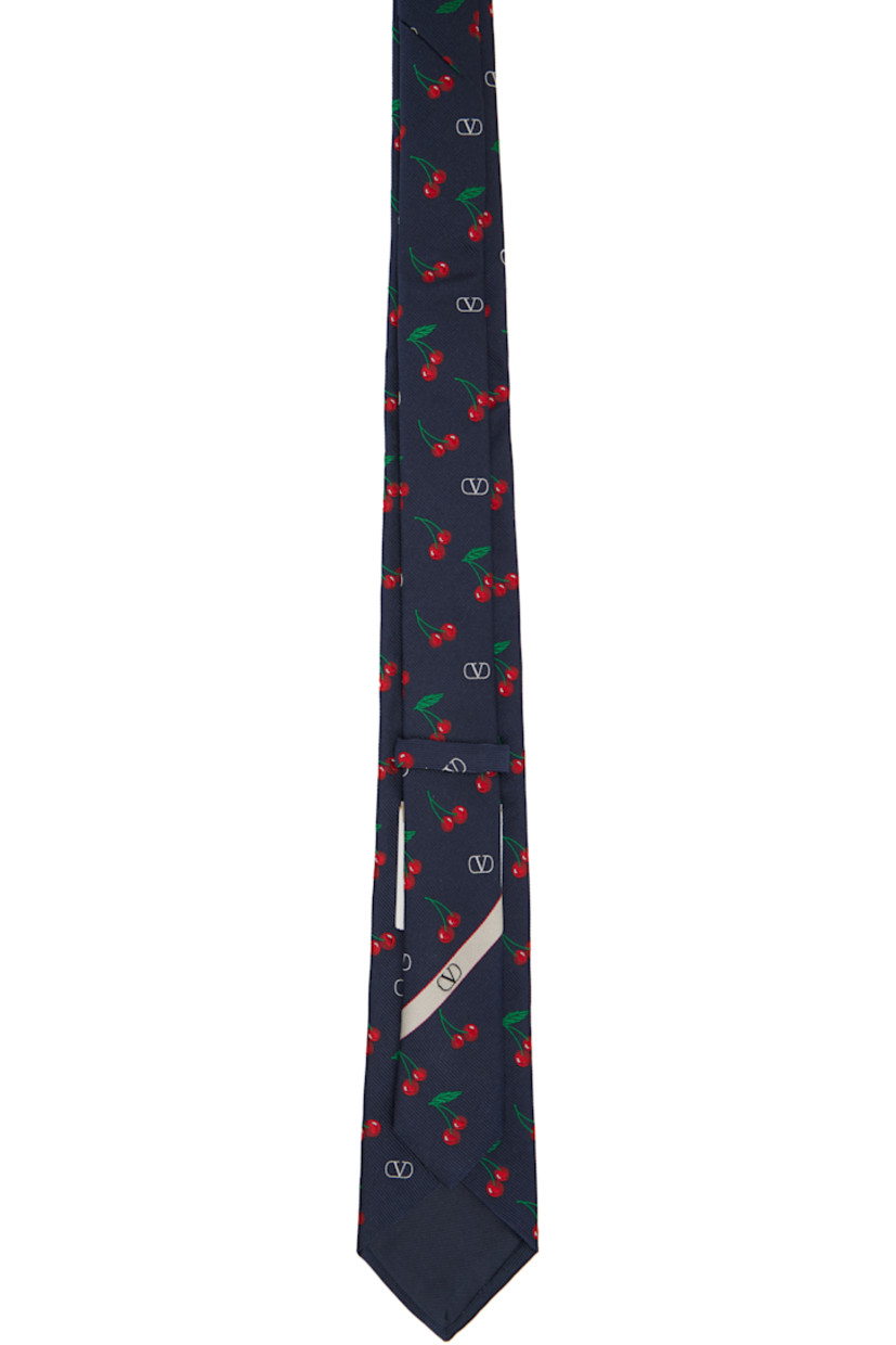 Yarn-dyed silk faille tie. 

· Jacquard logo graphic pattern throughout 
· Keeper loop at back face
· W3"

Supplier color: Nvy/Brr/Ross/Vrd