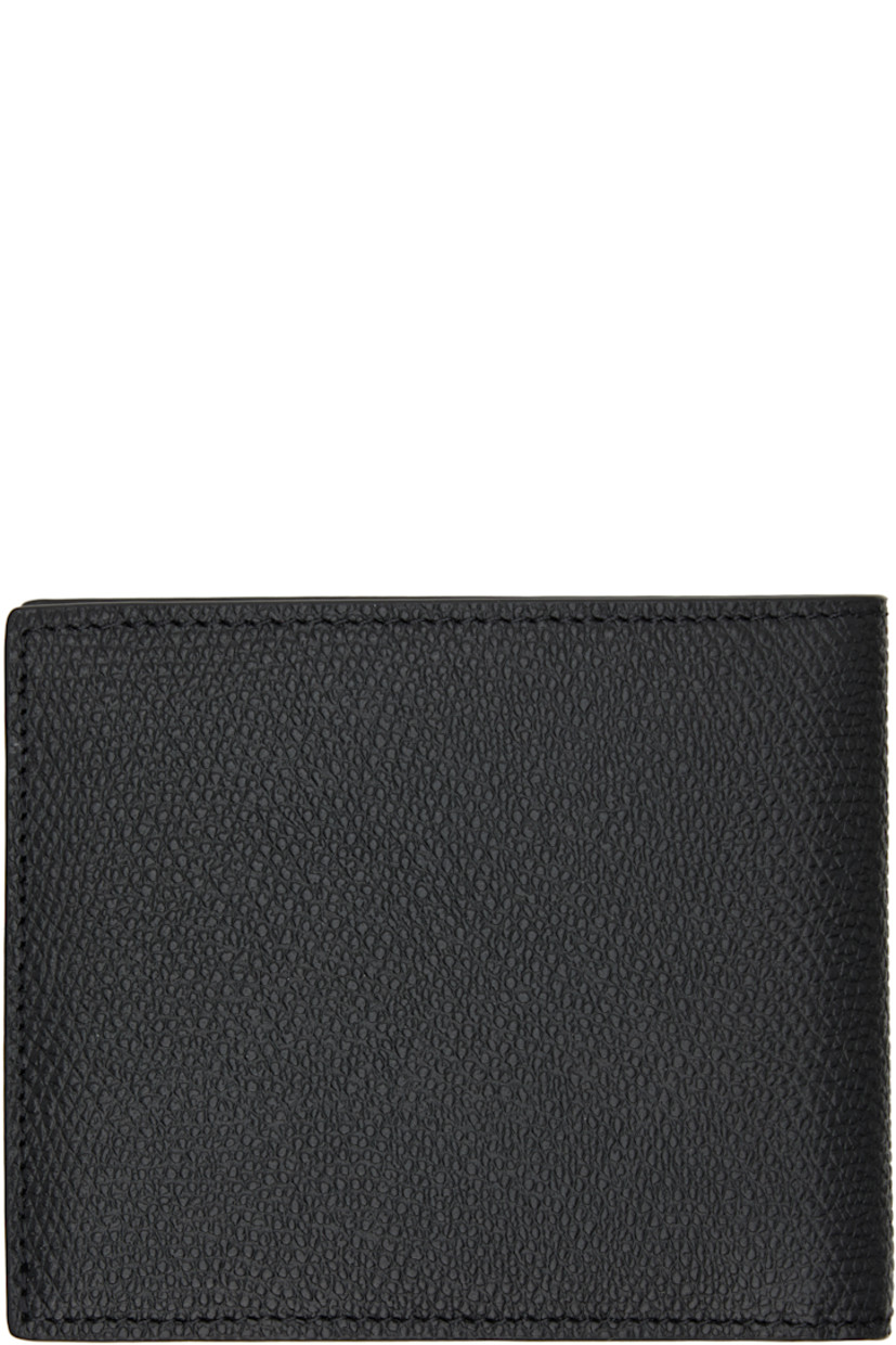 Pebble-grained calfskin bifold wallet. 

· Logo hardware at face
· Eight card slots at interior 
· Two patch pockets and one note slot
· Canvas lining 
· Silver-tone hardware
· H3.5" x W4" x D0.75"

Supplier color: Nero