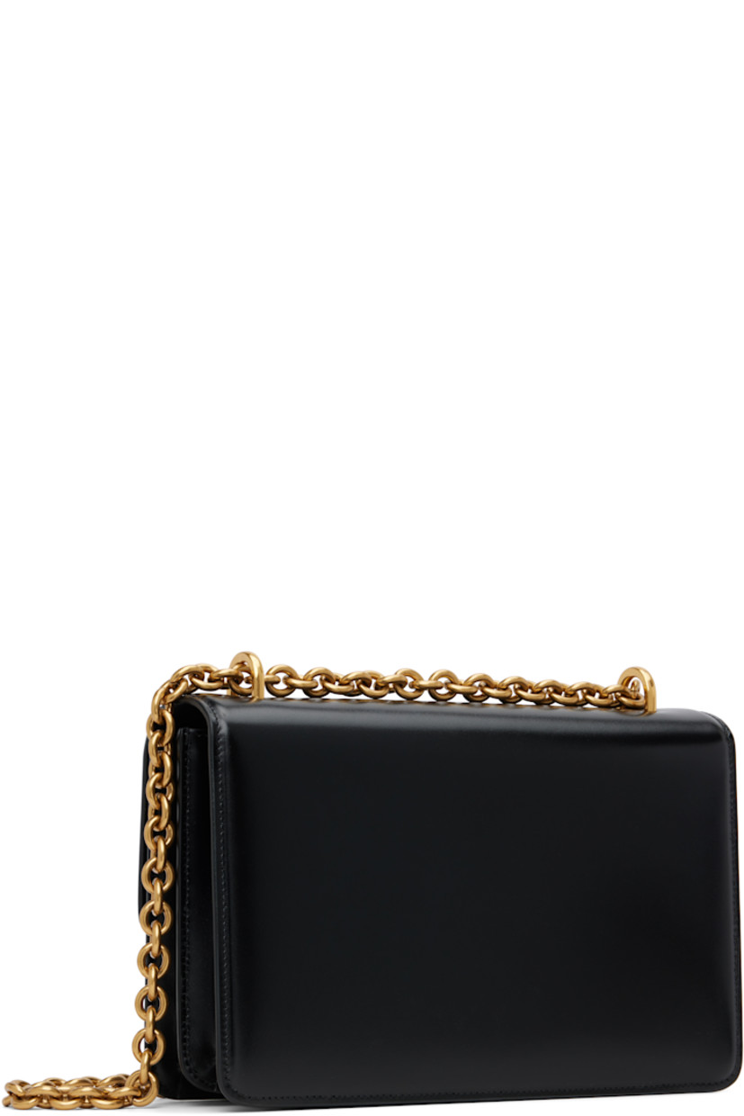 Buffed calfskin messenger bag.

· Sliding cable chain crossbody strap
· Logo hardware at face
· Magnetic press-stud flap
· Zip pocket and card slot at two-compartment interior 
· Leather lining
· Gold-tone hardware
· H6.5" x W9.5" x D3"

Supplier color: Nero