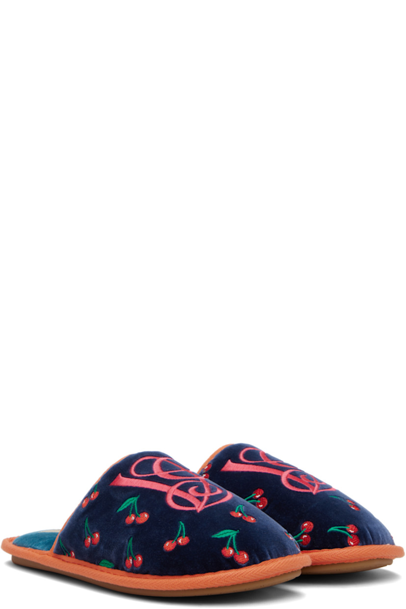 Padded velvet slippers. 

· Graphic pattern embroidered throughout
· Logo embroidered at vamp
· Logo patch at padded footbed
· Logo-treaded rubber sole

Supplier color: Indigo/Red/Green