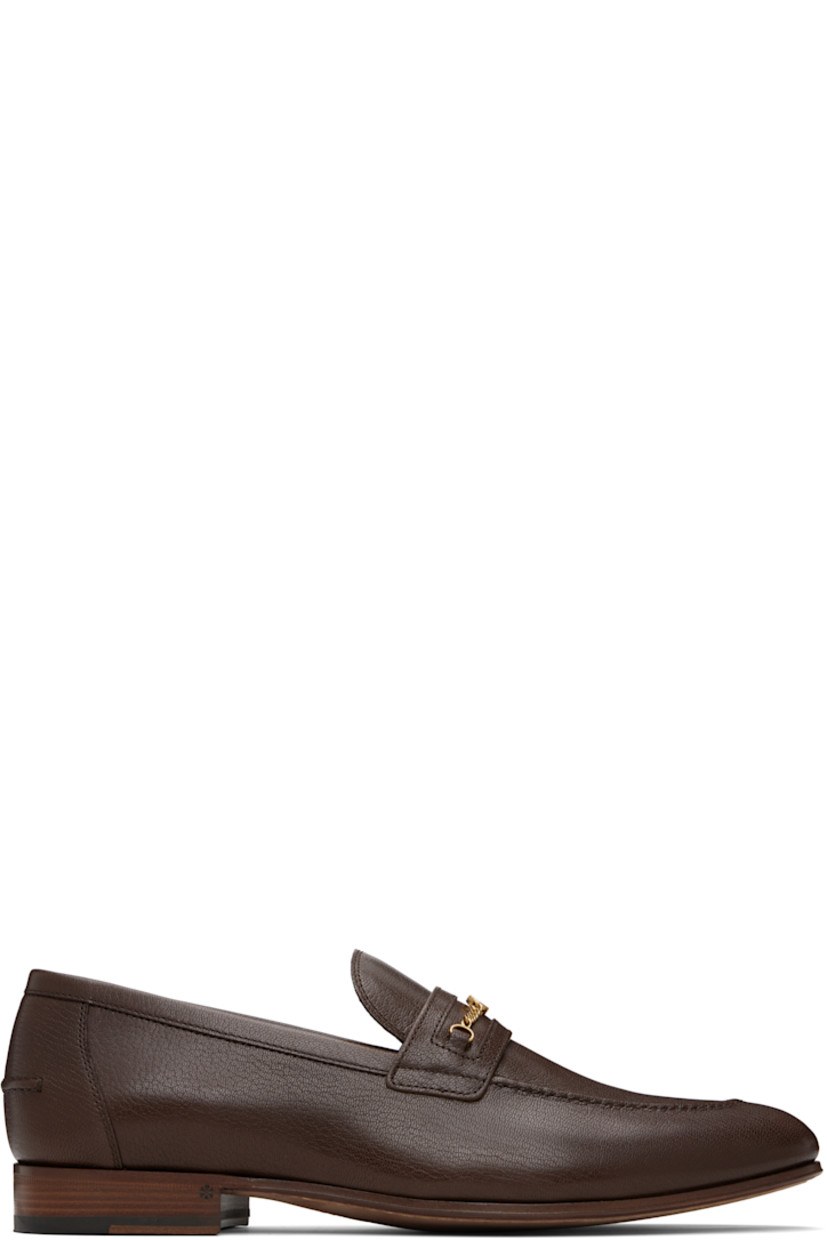 Grained kidskin loafers.

· Moc toe
· Curb chain with logo hardware at vamp
· Pinched seam at heel counter
· Buffed leather lining
· Stacked leather heel with rubber injection
· Leather sole

Supplier color: Bark brown