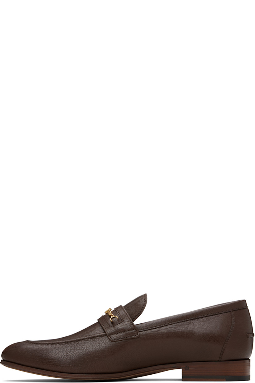 Grained kidskin loafers.

· Moc toe
· Curb chain with logo hardware at vamp
· Pinched seam at heel counter
· Buffed leather lining
· Stacked leather heel with rubber injection
· Leather sole

Supplier color: Bark brown