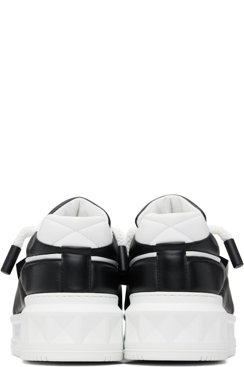 Low-top quilted nappa leather sneakers.

· Perforations at toe and sides
· Lace-up closure
· Logo printed at padded tongue
· Concealed elasticized gusset at tongue
· Padded collar
· Logo printed at outer side
· Signature pyramid stud at outer side
· Buffed leather and mesh lining
· Logo embossed at platform rubber midsole
· Treaded rubber sole
· Platform: H2"

Supplier color: White/Black