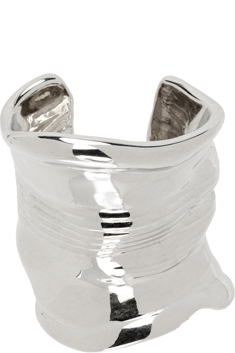 Sculptural open cuff bracelet in silver-tone brass.

D2.75"

Supplier color: Silver