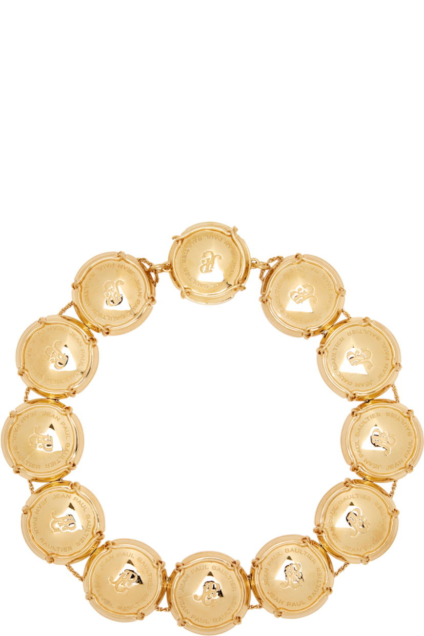 Rope chain necklace in gold-tone brass.

· Logo-engraved charms at length
· Magnetic fastening
· L15"

Supplier color: Gold