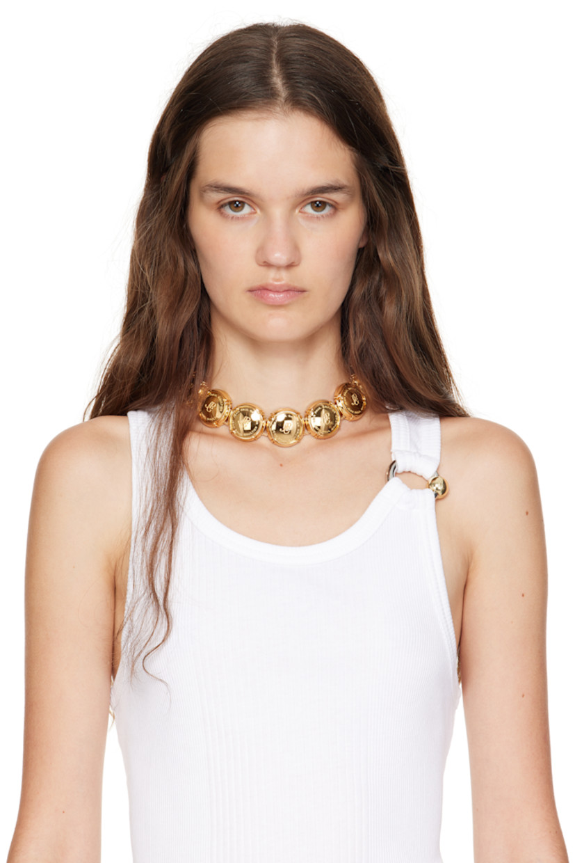 Rope chain necklace in gold-tone brass.

· Logo-engraved charms at length
· Magnetic fastening
· L15"

Supplier color: Gold