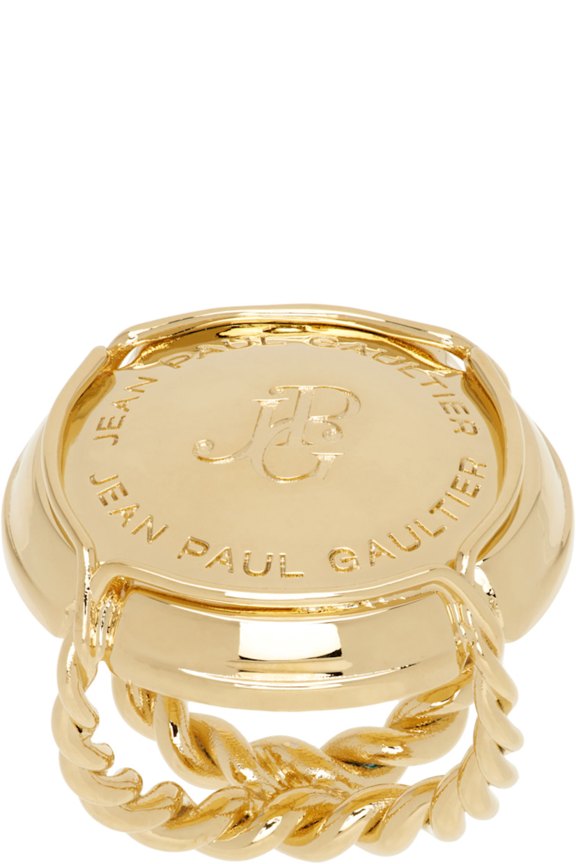 Sculptural ring in gold-tone brass. 

· Twisted detailing throughout
· Logo engraved at face

Supplier color: Gold