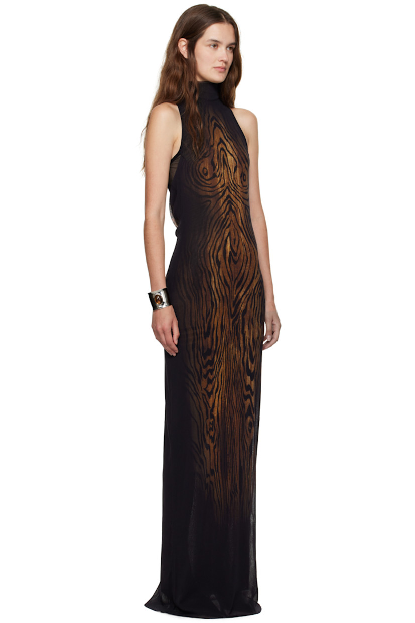Sheer nylon tulle maxi dress.

· Graphic pattern printed throughout
· Mock neck
· Raw edge at hem 
· Racer back
· Locker loop at back collar
· Fully lined

Supplier color: Black