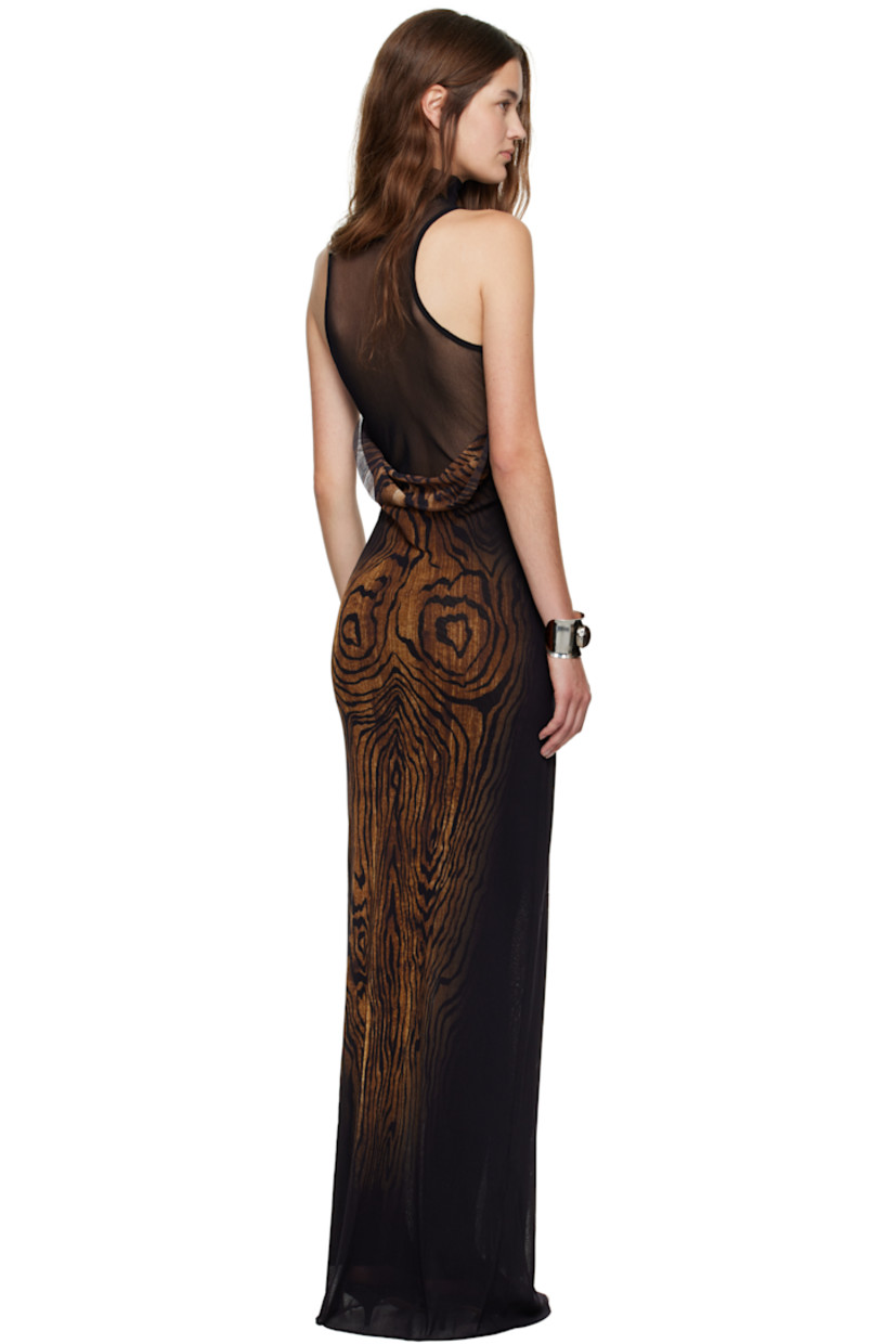 Sheer nylon tulle maxi dress.

· Graphic pattern printed throughout
· Mock neck
· Raw edge at hem 
· Racer back
· Locker loop at back collar
· Fully lined

Supplier color: Black