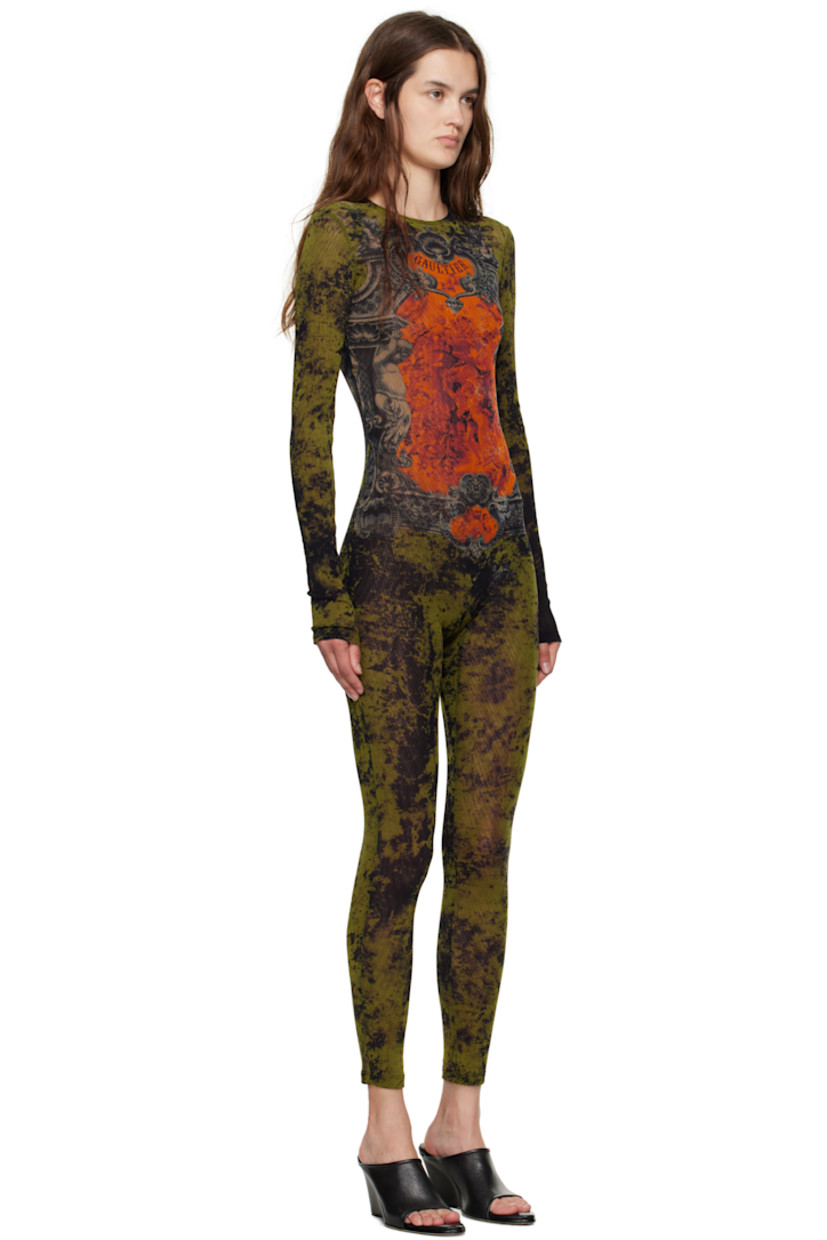 Sheer nylon tulle jumpsuit.

· Graphic pattern printed throughout
· Crewneck
· Logo printed at chest and back
· Zip closure and locker loop at back
· Fully lined

Supplier color: Orange