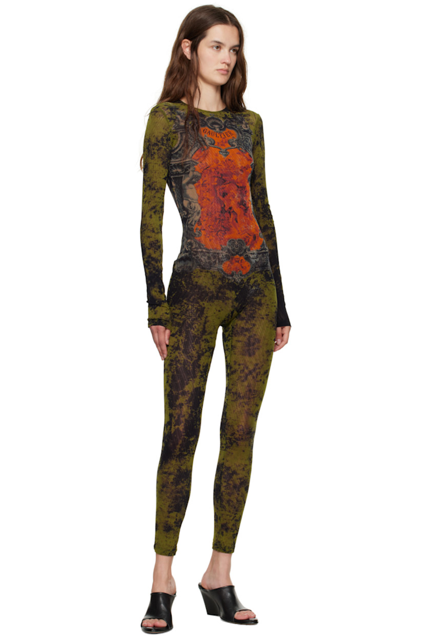 Sheer nylon tulle jumpsuit.

· Graphic pattern printed throughout
· Crewneck
· Logo printed at chest and back
· Zip closure and locker loop at back
· Fully lined

Supplier color: Orange