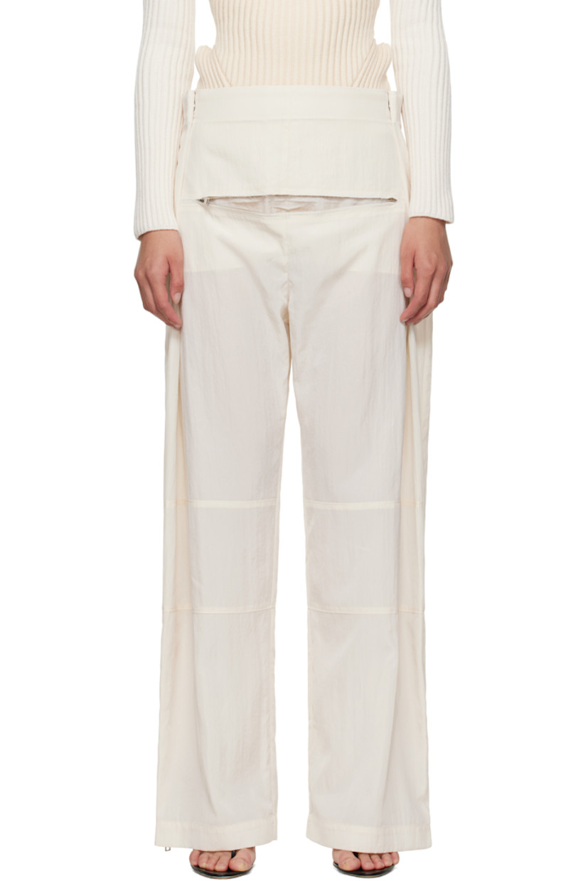 Crinkled lyocell-blend sateen trousers.

· Paneled construction
· Wide-leg
· Adjustable press-studs at waistband
· Zip pocket at front
· Zip vent at cuffs
· Locker loop at back waist
· Logo-engraved silver-tone hardware

Supplier color: Ecru