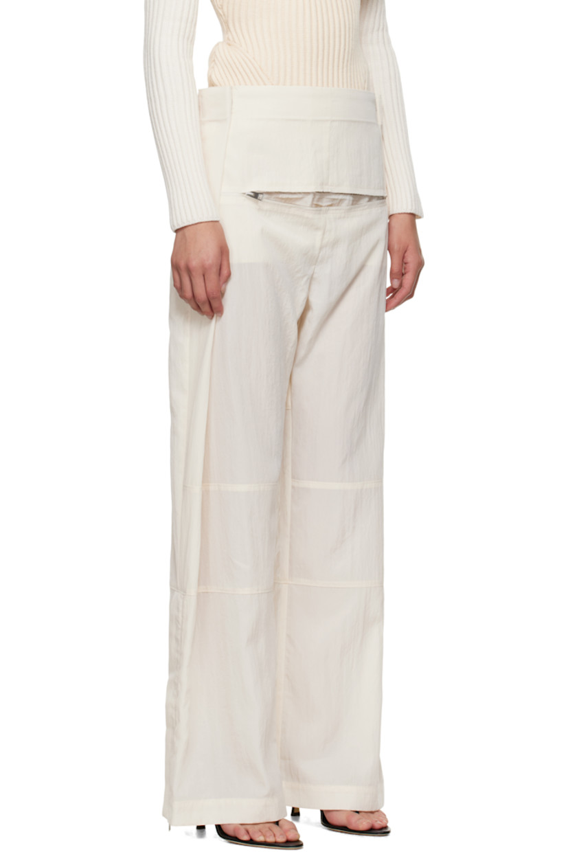 Crinkled lyocell-blend sateen trousers.

· Paneled construction
· Wide-leg
· Adjustable press-studs at waistband
· Zip pocket at front
· Zip vent at cuffs
· Locker loop at back waist
· Logo-engraved silver-tone hardware

Supplier color: Ecru