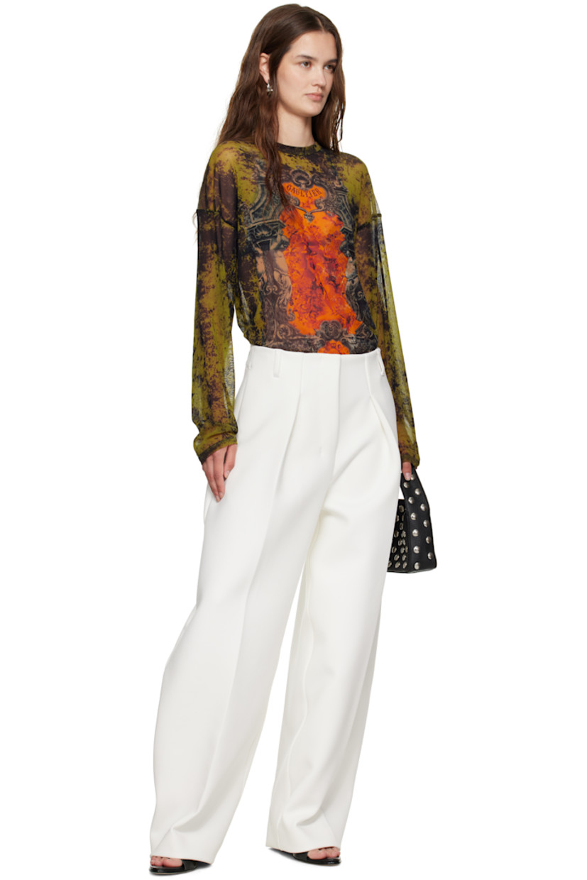 Sheer nylon tulle top.

· Graphic pattern printed throughout
· Crewneck
· Logo printed at chest and back
· Dropped shoulders
· Locker loop at back collar

Supplier color: Orange