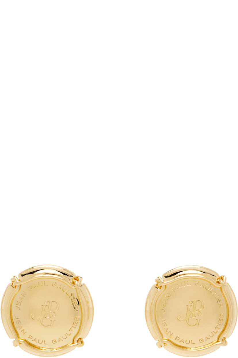 Pair of stud earrings in gold-tone brass.

· Logo engraved at face
· Post-stud fastening
· D1.25"

Supplier color: Gold
