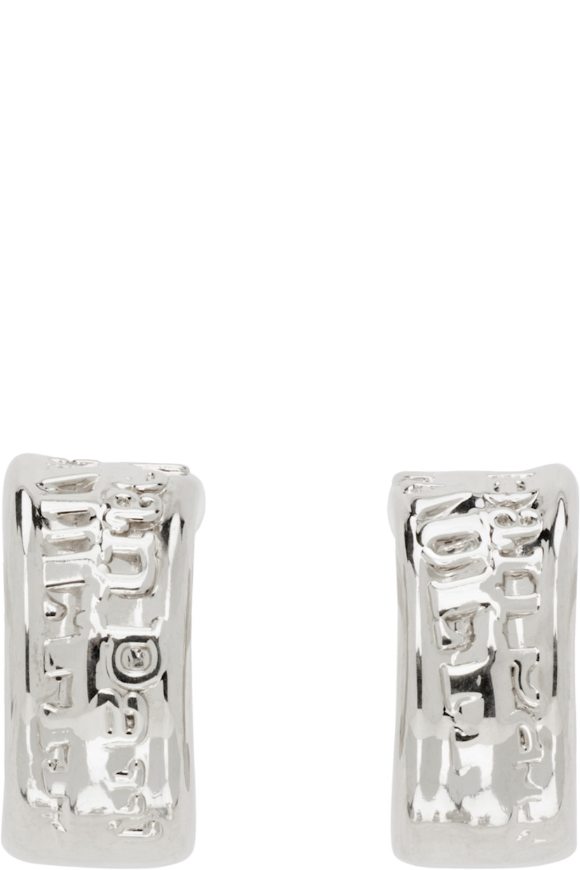 Pair of open hoop earrings in silver-tone brass.

· Logo at face
· Post-stud fastening
· D1.5"

Supplier color: Silver