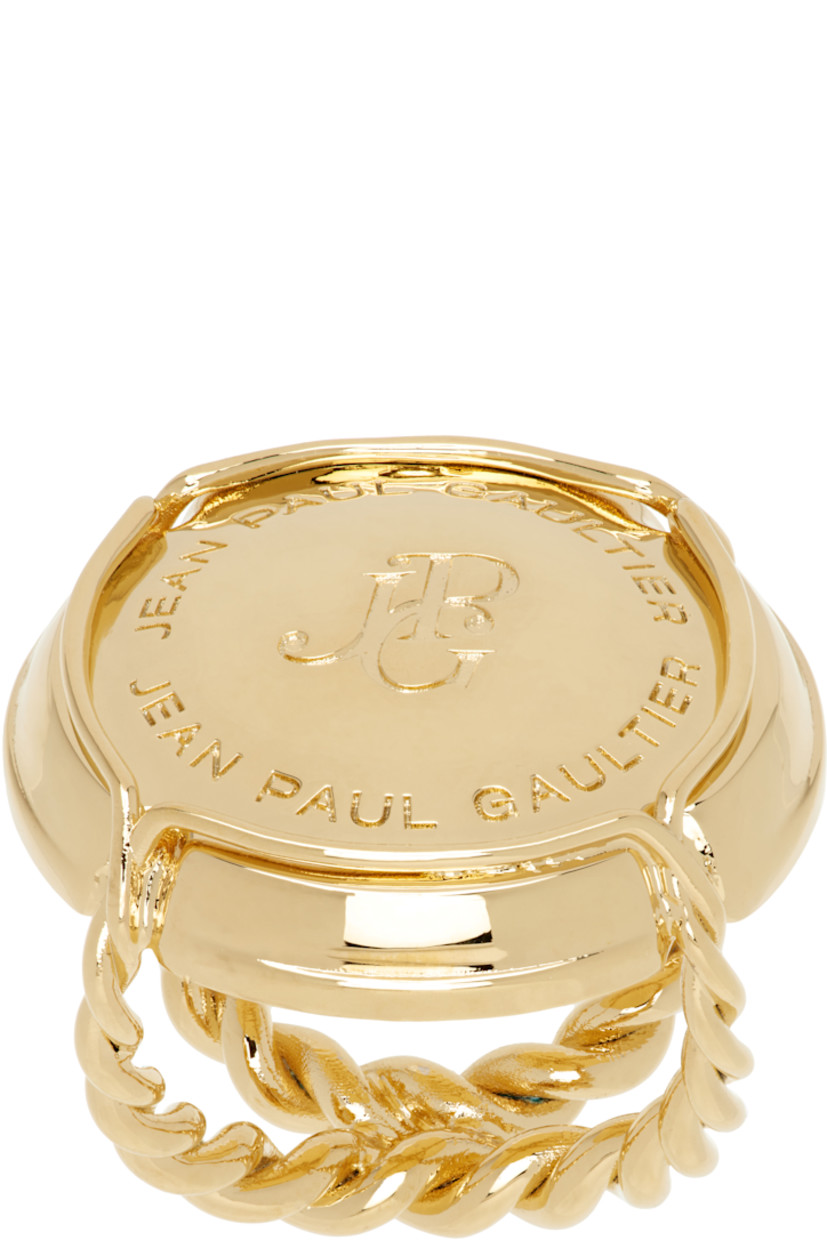 Sculptural ring in gold-tone brass. 

· Twisted detailing throughout
· Logo engraved at face

Supplier color: Gold