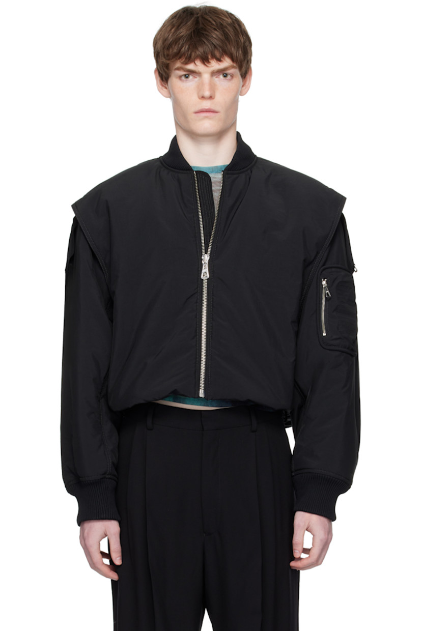Insulated nylon-blend taffeta bomber jacket. Concealed zip expansion panel with stowaway hood at back.

· Rib-knit stand collar and cuffs
· Zip closure
· Gussets at front
· Press-stud seam pockets at waist
· Cropped hem
· Inset partial rib-knit hem
· Dropped shoulders
· Logo-embossed zip pocket at sleeve
· Locker loop at back collar
· Patch pocket at interior
· Full satin lining
· Logo-engraved silver-tone hardware

Supplier color: Black