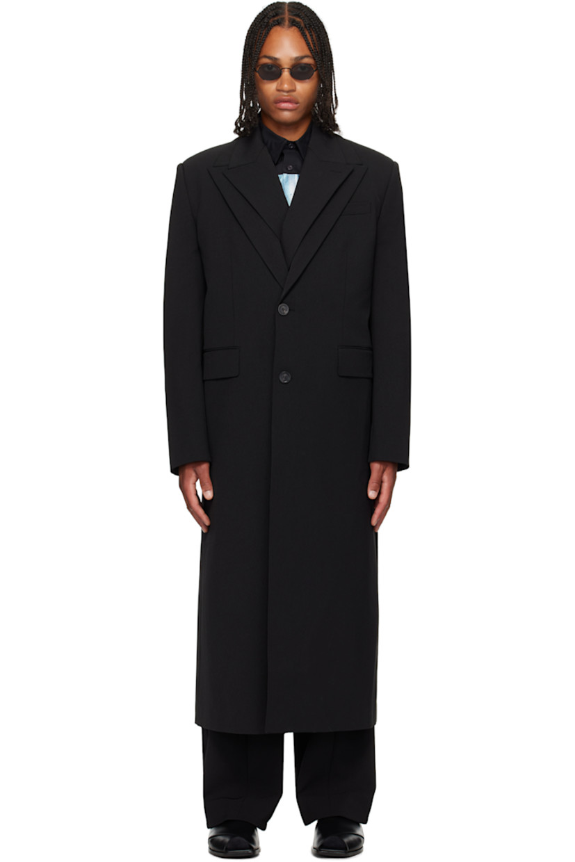 Stretch nylon gabardine coat.

· Layered construction
· Peaked lapels
· Double-breasted button closures
· Welt pocket at chest
· Flap pockets at waist
· Padded shoulders
· Buttoned surgeon's cuffs
· Locker loop at back collar
· Central vent at back hem
· Welt pockets at interior
· Full satin twill lining
· Logo-engraved horn hardware

Supplier color: Black
