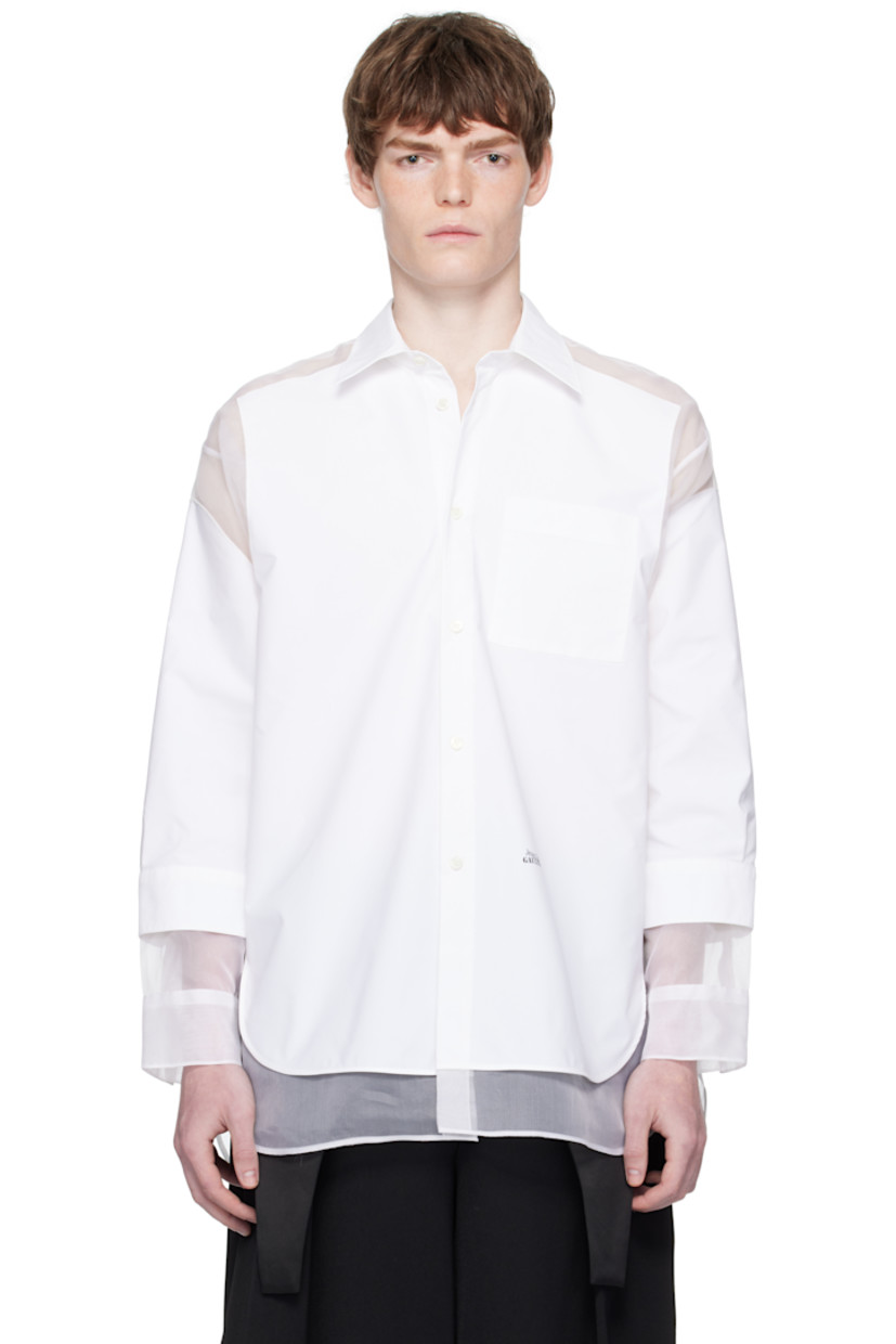 Nylon poplin and silk chiffon shirt.

· Paneled and layered construction
· Spread collar
· Button closure
· Patch pocket at chest
· Logo printed at front waist
· Droptail hem
· Buttoned barrel cuffs
· Locker loop at back collar
· Box pleat at back yoke
· Logo-engraved mother-of-pearl hardware

Supplier color: White