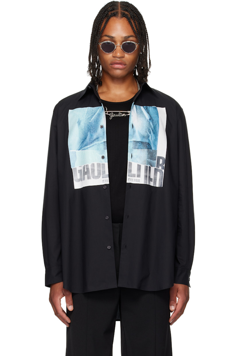 Cotton poplin shirt.

· Spread collar
· Button closure
· Logo graphic printed at front
· Shirttail hem
· Buttoned barrel cuffs
· Locker loop and box pleat at back yoke
· Mother-of-pearl hardware

Supplier color: Black