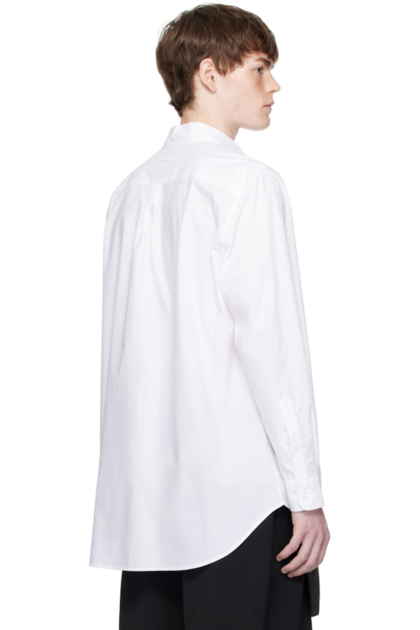 Cotton poplin shirt.

· Spread collar
· Button closure
· Logo graphic printed at front
· Droptail hem
· Buttoned barrel cuffs
· Locker loop at back collar
· Box pleat at back yoke
· Mother-of-pearl hardware

Supplier color: White