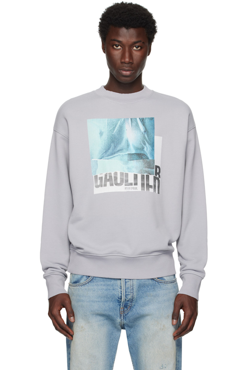 Cotton French terry sweatshirt.

· Rib-knit crewneck, hem, and cuffs
· Logo graphic printed at front
· Dropped shoulders
· Locker loop at back collar

Supplier color: Heather grey/Indigo/Vintage blue