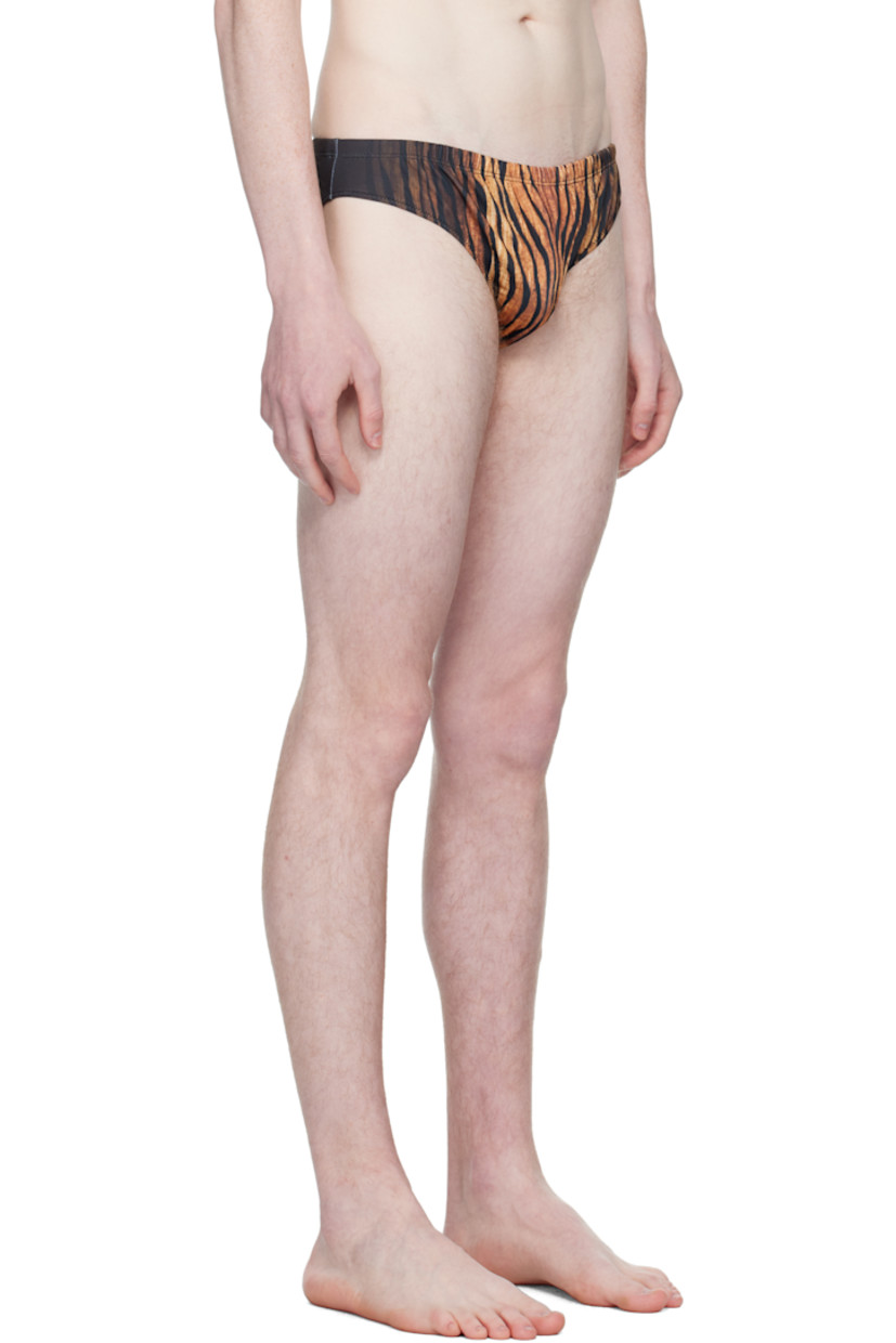 Stretch jersey swim briefs.

· Graphic pattern printed throughout
· Elasticized waistband 
· Locker loop at back waist
· Fully lined

Supplier color: Black