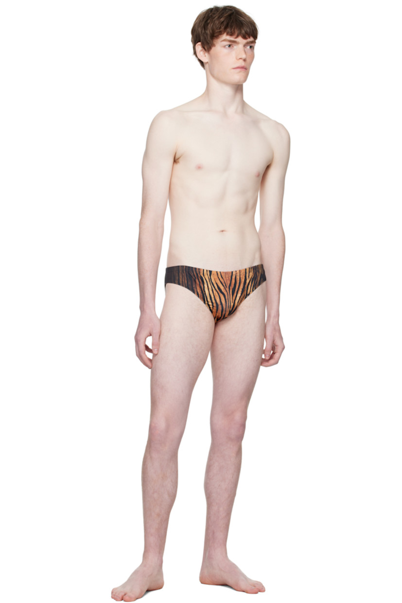 Stretch jersey swim briefs.

· Graphic pattern printed throughout
· Elasticized waistband 
· Locker loop at back waist
· Fully lined

Supplier color: Black