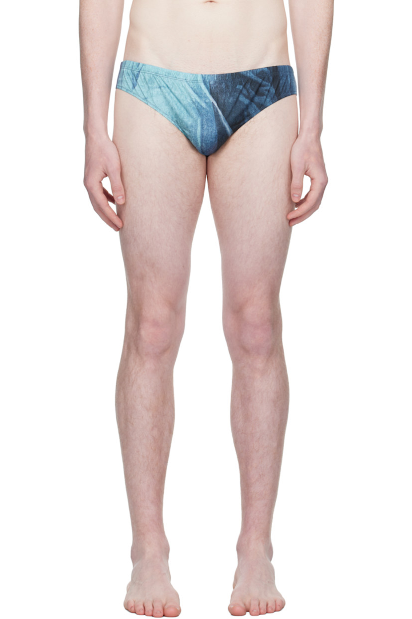 Stretch jersey swim briefs.

· Graphic pattern printed throughout
· Elasticized waistband 
· Locker loop at back waist
· Fully lined

Supplier color: Indigo/Vintage blue