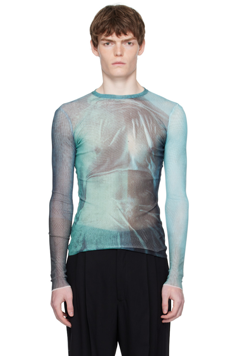 Semi-sheer nylon tulle top.

· Graphic pattern printed throughout
· Crewneck
· Raw edge at hem and cuffs
· Locker loop at back collar
· Fully lined

Supplier color: Indigo