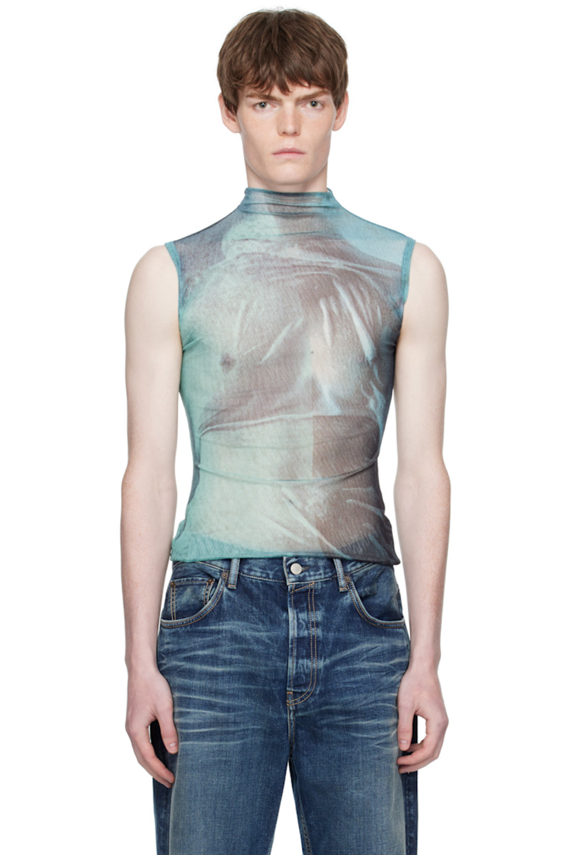 Semi-sheer nylon tulle turtleneck. 

· Graphic pattern printed throughout
· Locker loop at back collar
· Fully lined

Supplier color: Indigo/Vintage blue