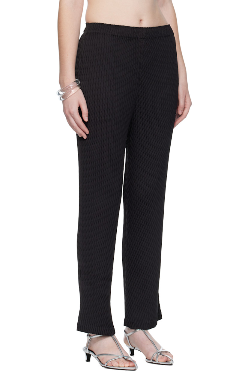 Garment-pleated tricot trousers.

· Elasticized waistband 
· Two-pocket styling
· Vented cuffs

Supplier color: Black