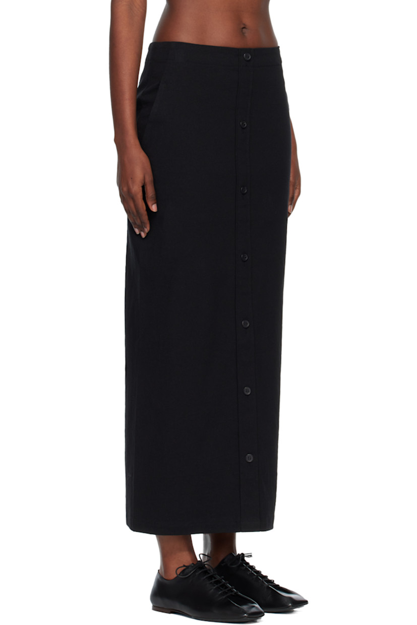 Stretch paper- and cotton-blend canvas maxi skirt.

· Two-pocket styling
· Button closure at front
· Zip closure at back

Supplier color: Black