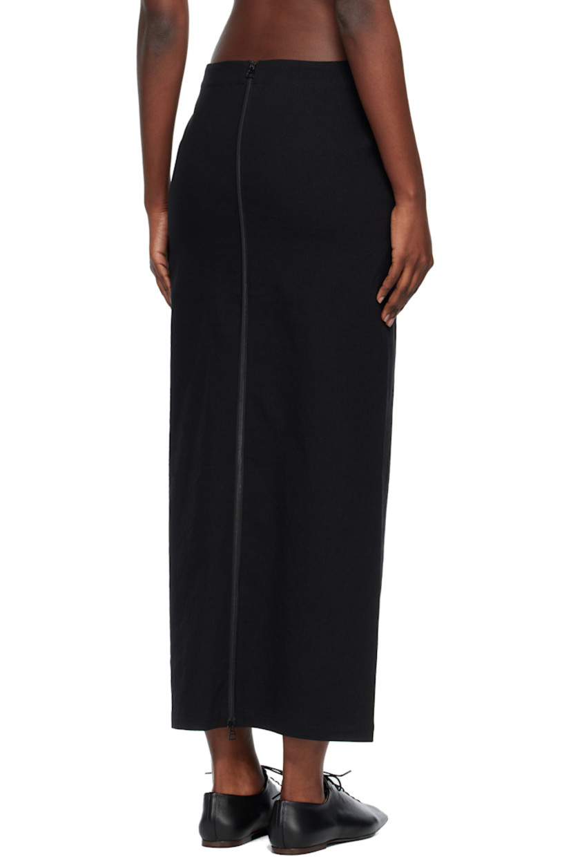 Stretch paper- and cotton-blend canvas maxi skirt.

· Two-pocket styling
· Button closure at front
· Zip closure at back

Supplier color: Black