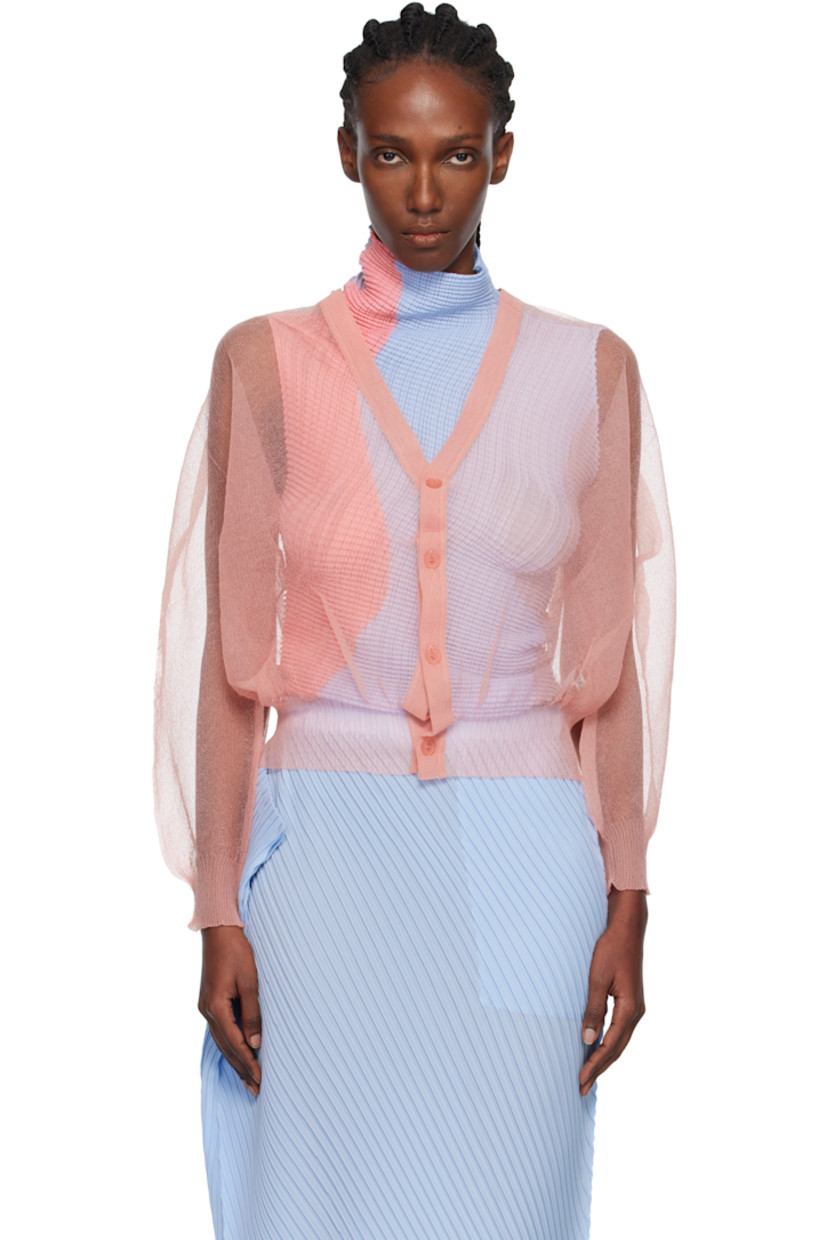 Sheer knit nylon cardigan.

· Rib-knit Y-neck, hem, and cuffs
· Balloon sleeves

Supplier color: Coral