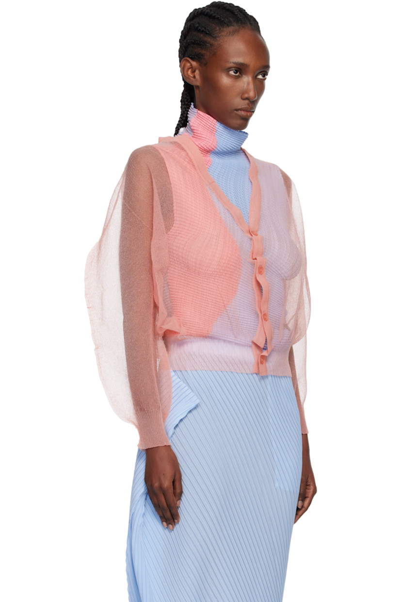 Sheer knit nylon cardigan.

· Rib-knit Y-neck, hem, and cuffs
· Balloon sleeves

Supplier color: Coral