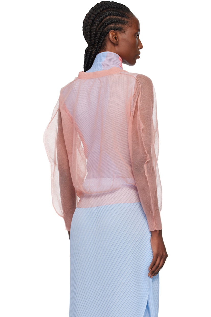 Sheer knit nylon cardigan.

· Rib-knit Y-neck, hem, and cuffs
· Balloon sleeves

Supplier color: Coral