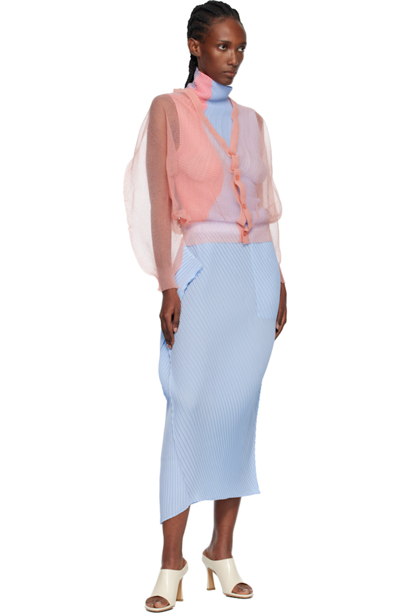 Sheer knit nylon cardigan.

· Rib-knit Y-neck, hem, and cuffs
· Balloon sleeves

Supplier color: Coral