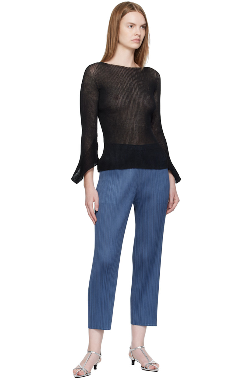 Semi-sheer rib-knit sweater.

· Boatneck
· Modified bell sleeves

Supplier color: Black