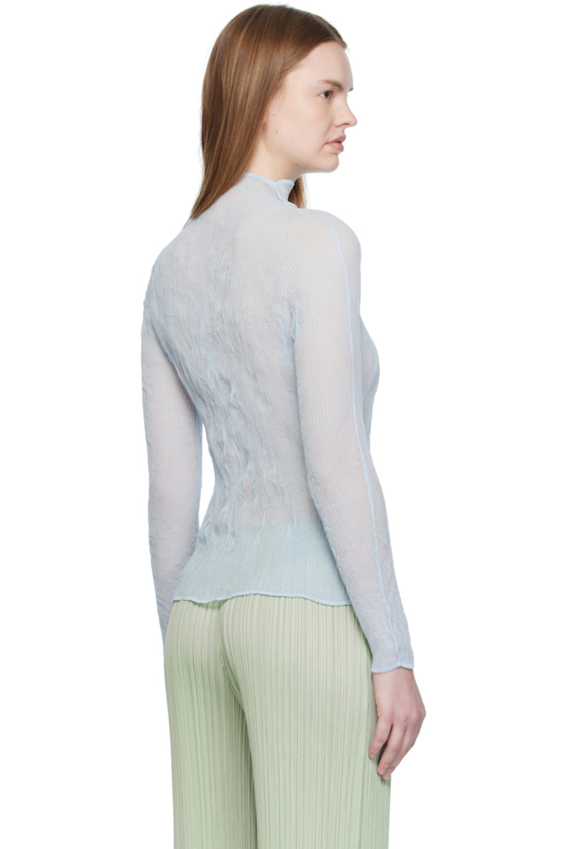 Sheer garment-pleated recycled polyester chiffon top.

· Turtleneck
· Raglan sleeves

Supplier color: Nigella blue