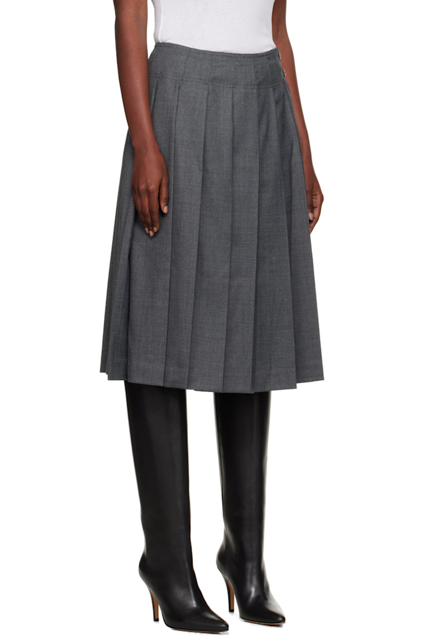Wool-blend flannel midi skirt.

· Pleats throughout
· Two-pocket styling
· Button fastening and zip closure at side seam
· Full satin lining

Supplier color: Gray