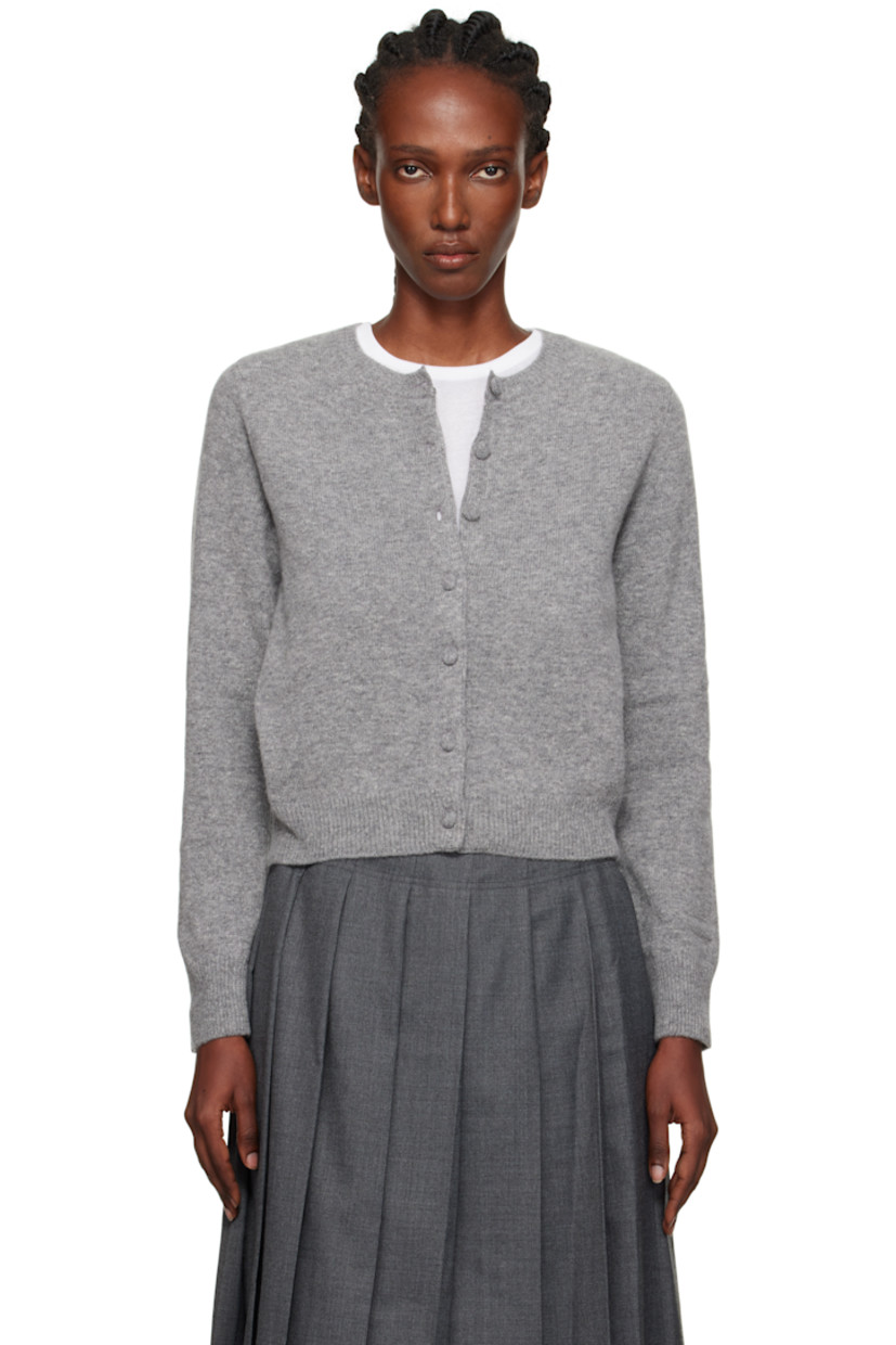 Knit wool- and cashmere-blend cardigan.

· Rib-knit round neck, hem, and cuffs
· Textile-covered button closure

Supplier color: Gray