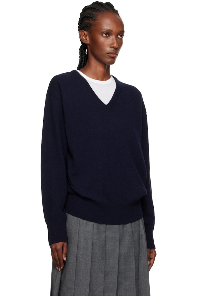 Knit wool-blend sweater.

· Rib-knit V-neck, hem, and cuffs
· Dropped shoulders

Supplier color: Navy