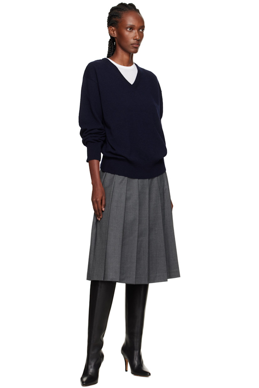 Knit wool-blend sweater.

· Rib-knit V-neck, hem, and cuffs
· Dropped shoulders

Supplier color: Navy