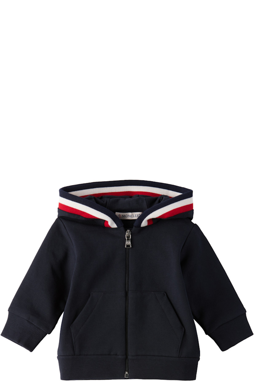Stretch cotton fleece hoodie. 

· Tricolor rib-knit trim at hood
· Zip closure 
· Patch pockets at waist
· Rib-knit hem and cuffs
· Tricolor logo patch at sleeve

Stretch cotton fleece sweatpants.

· Elasticized waistband
· Two-pocket styling
· Mock fly 
· Rib-knit cuffs
· Logo flag at back waistband 

Supplier color: Navy blue 

Moncler Enfant Size: child's height
1-3M: 21.7" / 55 cm
3-6M: 24.4" / 62 cm
6-9M: 26.7" / 68 cm
9-12M: 29.9" / 76 cm
12-18M: 31.4" / 80 cm 
18-24M: 33.9" / 86 cm
2Y: 36.2" / 92 cm
3Y: 39.4" / 100 cm