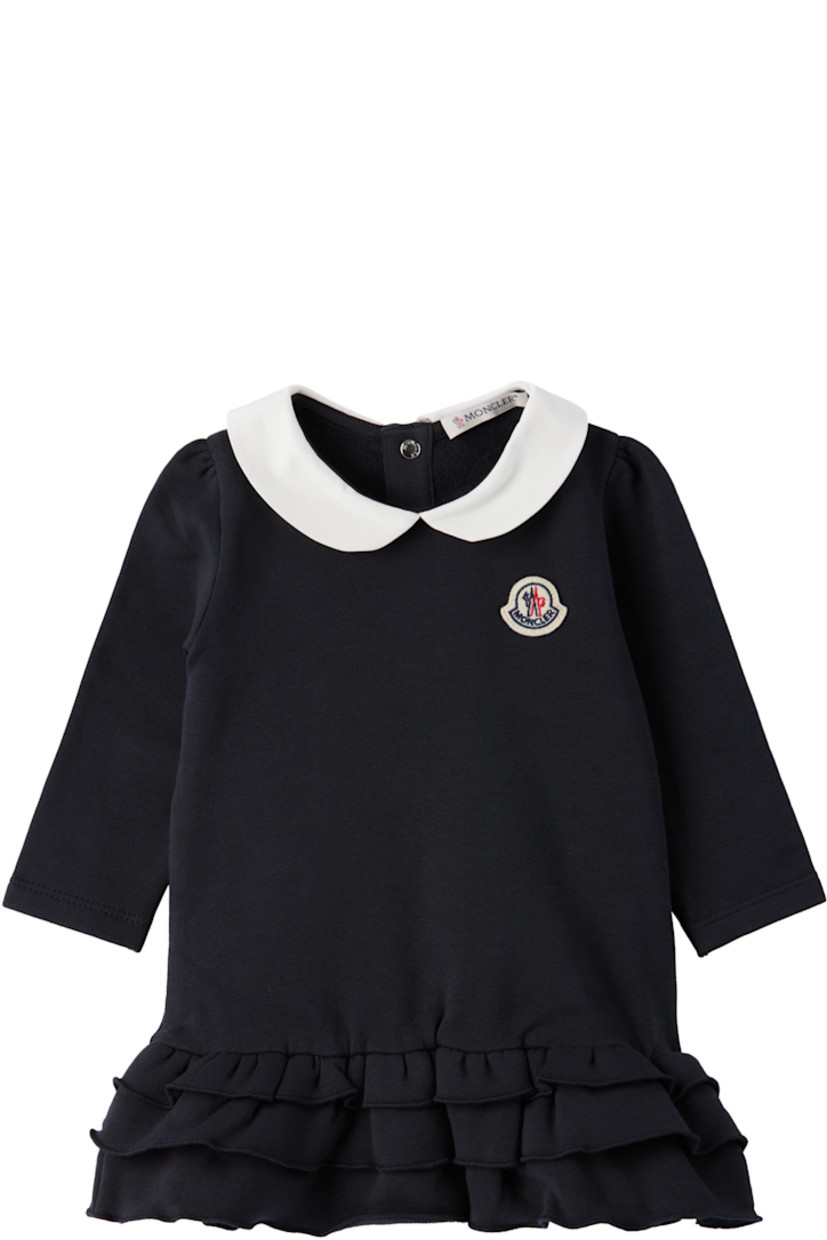Stretch cotton jersey dress.

· Twill Peter Pan collar 
· Tricolor felted logo patch at chest
· Ruffles at tiered hem 
· Press-stud fastening at back collar for easy dressing
· Machine-wash

Supplier color: Blue navy 

Moncler Enfant Size: child's height
1-3M: 21.7" / 55 cm
3-6M: 24.4" / 62 cm
6-9M: 26.7" / 68 cm
9-12M: 29.9" / 76 cm
12-18M: 31.4" / 80 cm
18-24M: 33.9" / 86 cm
2Y: 36.2" / 92 cm
3Y: 39.4" / 100 cm